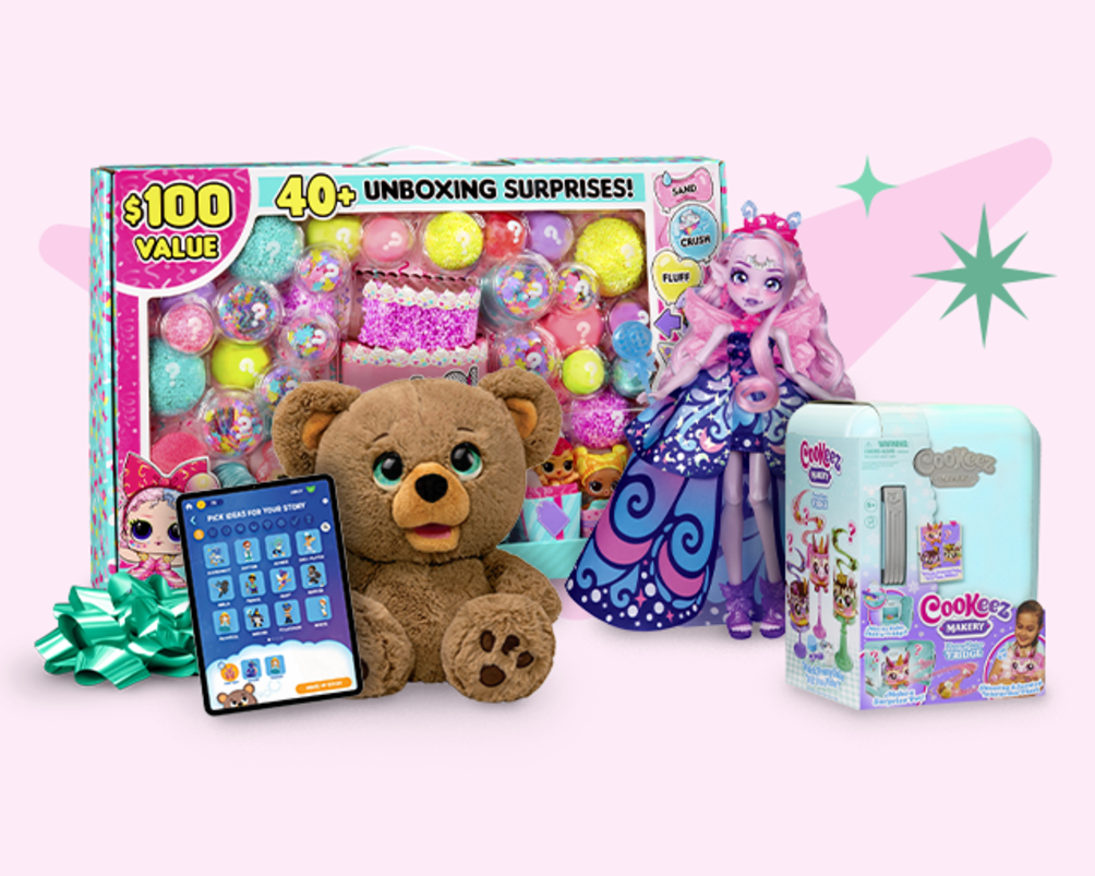 A cheerful teddy bear and a doll sit beside a vibrant box overflowing with toys, perfect for sparking imagination.