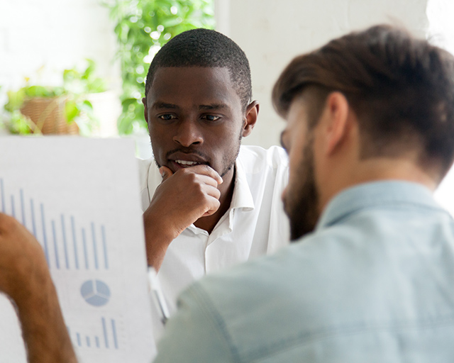 man looking at graph