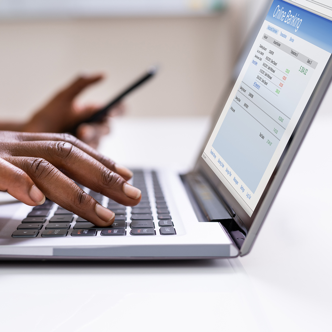 hands typing at a computer